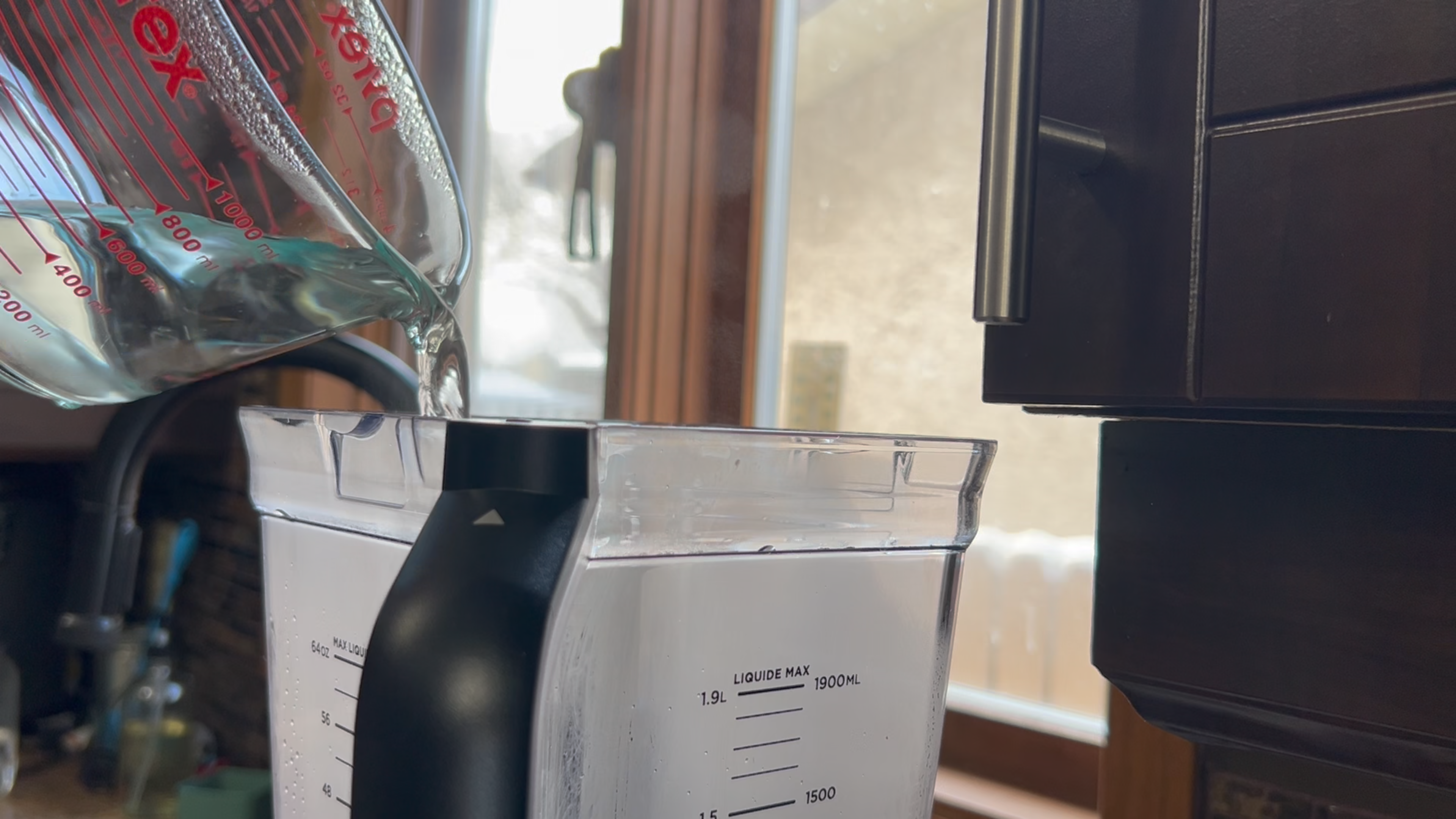 adding water to blender for coconut milk